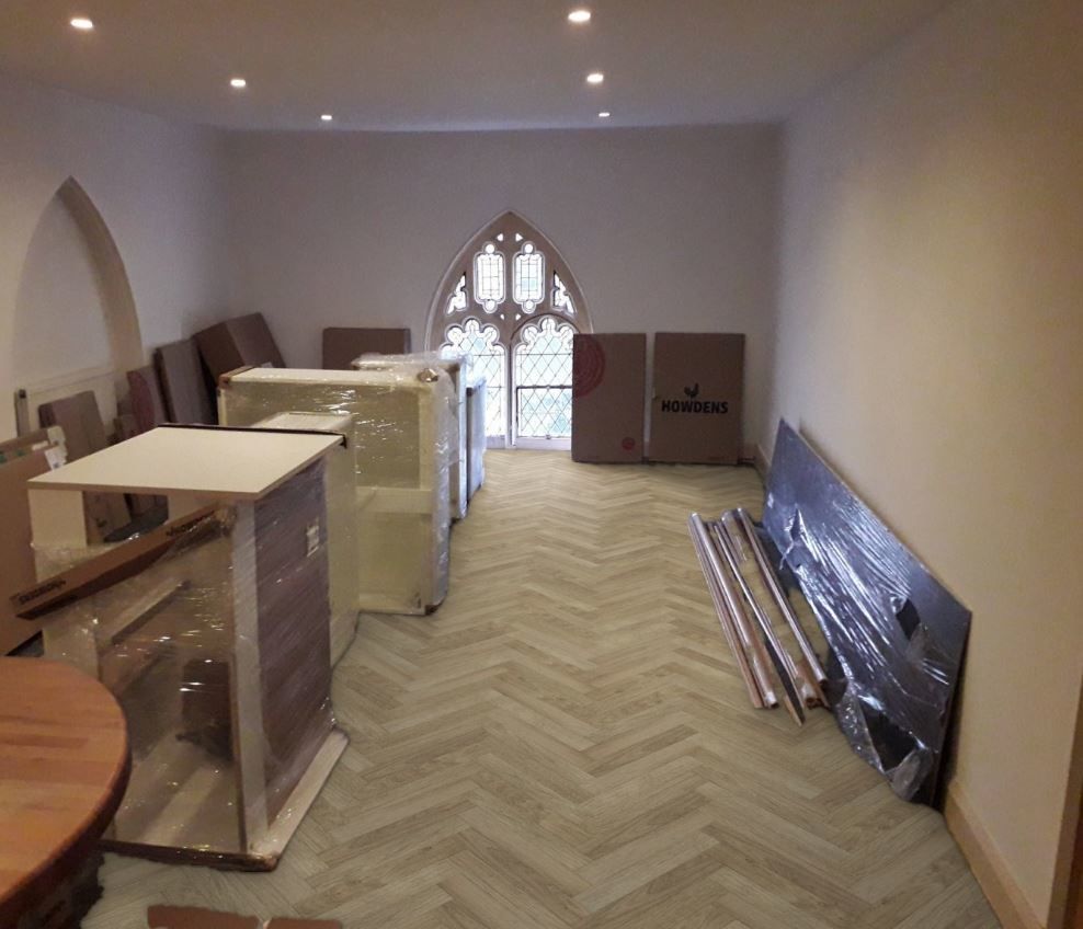 Grey herringbone LVT flooring in an Essex room