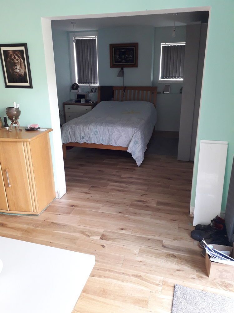 Engineered wood flooring fitted in a bedroom in Essex