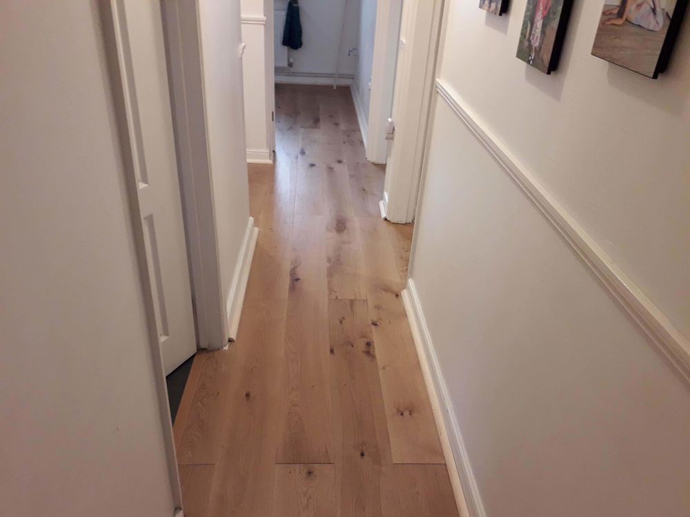 Wood flooring fitted along a hallway in an Essex home